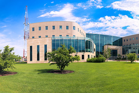 Photo of a campus building. Links to Roberta Cooper Tomlinson