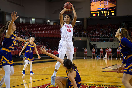 Students playing in a women's basketball game. Links to Gifts by Estate Note